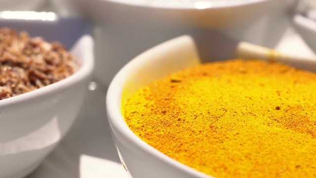 Dry spices on a rotary table. 4K. Macroshooting.