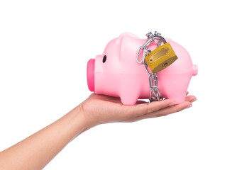 hand holding Piggy bank style money box chained together isolated on white background, concep...