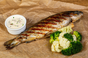 Grilled trout with sauce
