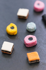 Liquorice allsorts candy sweets dark background