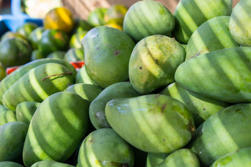 Fresh mangos are selling on a local fruit market of Bali, Indonesia