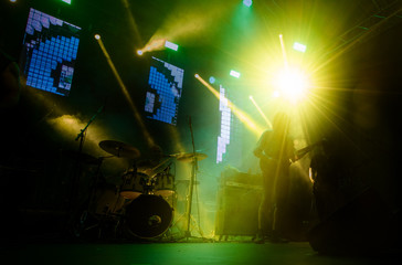 Fototapeta na wymiar Guitarist on a stage playing rock