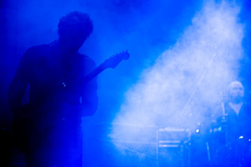 Obraz premium Guitarist on a stage playing rock