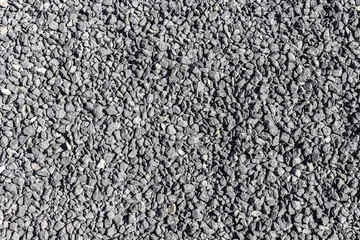 Surface of a decorative path from gray gravel.