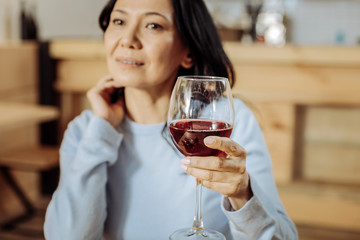 Cozy cafe. Lovely dreaming lady having rest while spending an evening in a restaurant
