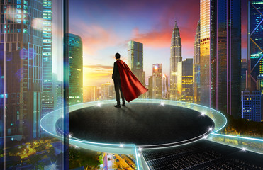 Businessman in suit and cape hero stand at round stage floating on the center of city skyline with...
