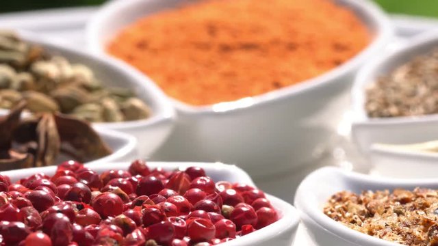 Dry spices on a rotary table. 4K. Macroshooting.