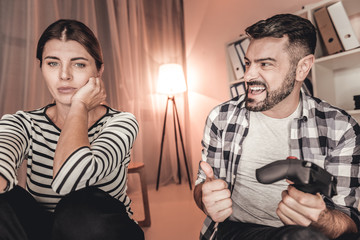 Best gamer. Proud excited man celebrating his victory in a video game