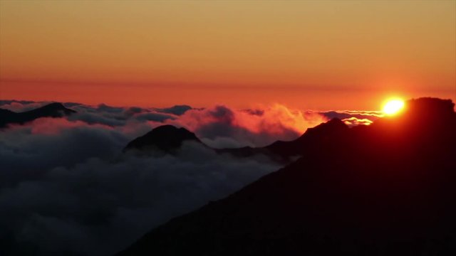 time lapse of dramatic clouds in the mountains during sunset