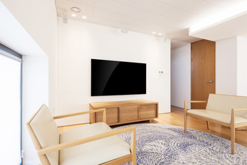 television with wood chair in a white interior