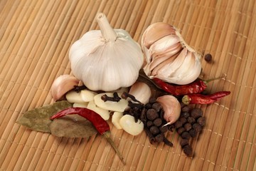 Chili Pepper, Garlic and Other Spices on Bamboo Mat