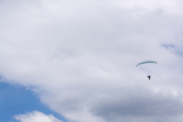 Paraglider in the distance and a cloud