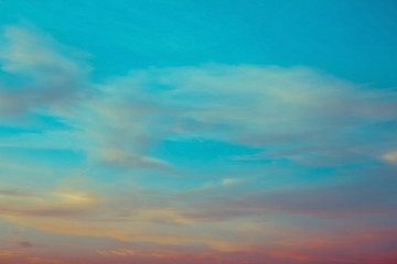 blue and orange sky clouds at sunset or sunrise.