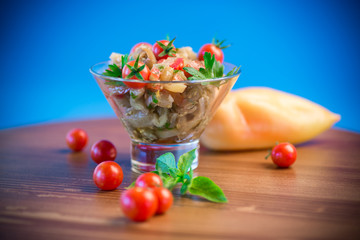 A warm salad of baked eggplant and peppers with cherry tomatoes