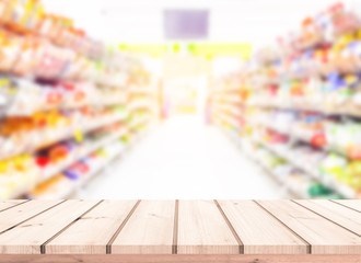 Wood table or wood floor with supermarket blur background for Product display