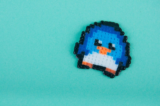 Cute plastic penguin made of thermo mosaic beads