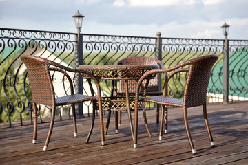 Fototapeta na wymiar wicker furniture on the summer terrace