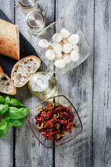 Ingredients ready for preparing bruschetta with sun-dried tomato