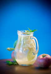 summer sweet cold compote of fresh apples with a sprig of mint
