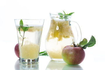 summer sweet cold compote of fresh apples with a sprig of mint
