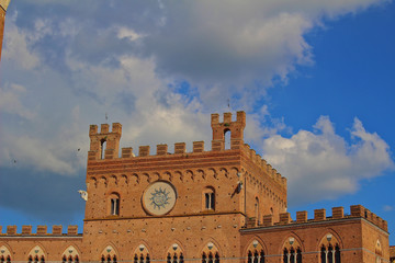 A view of the buildings, Palazzo Pubblico and the tower on Piazza del Campo in Siena, Italy