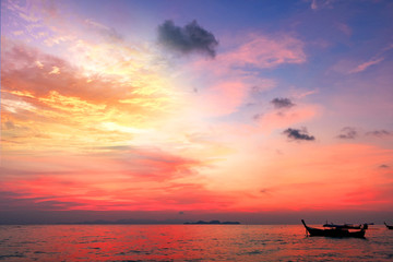 Sightseeing travel concept:Traditional thai boats at sunset beach