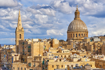 Fototapeta na wymiar Cityscape of Valetta with the huge dome of Basilica of Our Lady of Mount Carmel