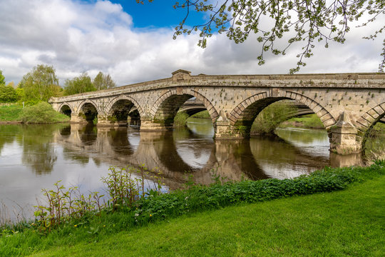 Atcham Old Bridge over the River Severn in Atcham, near Shrewsbury, Shropshire, England, UK