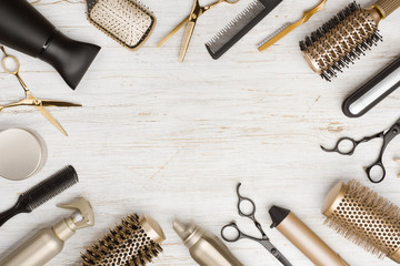Various hair dresser tools on wooden background with copy space - obrazy, fototapety, plakaty