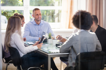 Group Of Businesspeople Sitting In Office