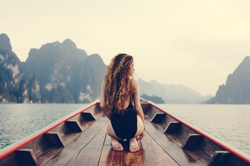 Beautiful woman posing on a boat - Powered by Adobe