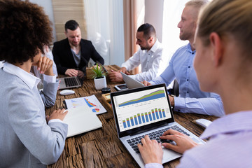 Stock Market Broker Working On Laptop