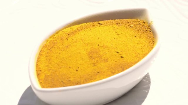 Dry spices curries on a rotary table. 4K. Macroshooting.