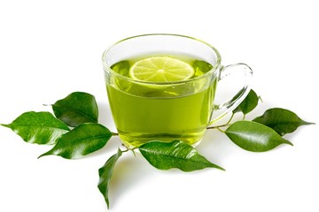 Green Tea Leaves and Green Tea in Cup with Lemon