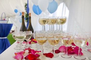 champagne glasses and rose petals