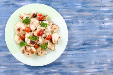 Dietary dish of cauliflower with tomatoes