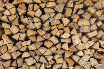 Pattern of a lot of firewood as a background