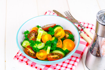 Dietary salad from tomatoes and cucumbers