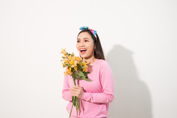 Obraz na płótnie Canvas Lifestyle leisure international women's day concept. Close up portrait of lovely cute adorable excited delightful attractive woman holding flowers isolated on white background