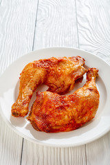 fried chicken legs on a white plate