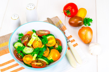 Dietary salad from tomatoes and cucumbers