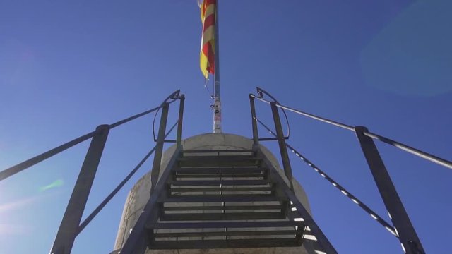 Flag of Valencia at the top of Torres de Quart