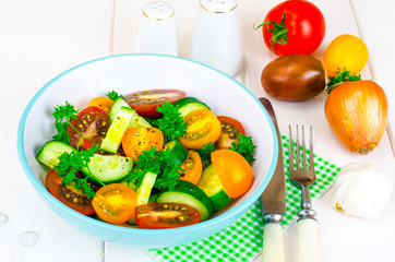 Dietary salad from tomatoes and cucumbers