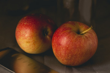 Ripe red apples on dark background