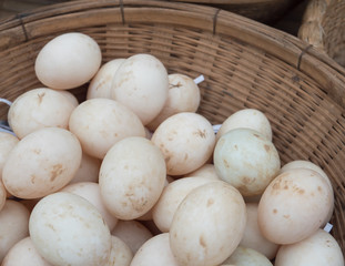 Duck eggs on straw.
