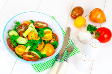 Dietary salad from tomatoes and cucumbers