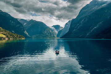 a lonely boat on a beautiful blue lake