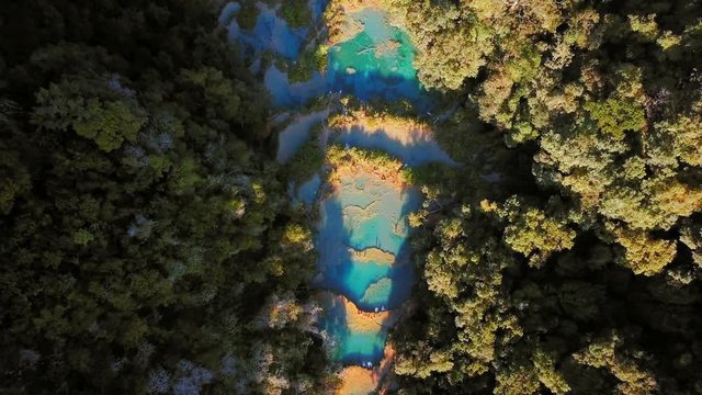 Aerial view of Semuch Champey turquoise pools, summer evening, Top Shot Pull Back