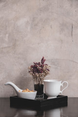 Coffee cup with flower in vintage style.