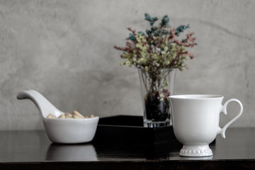 Coffee cup with flower in vintage style.